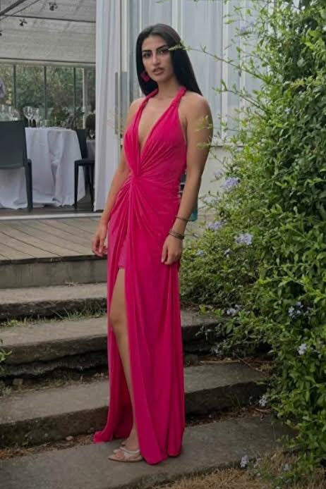 Long fuchsia dress with halter neckline and front slit