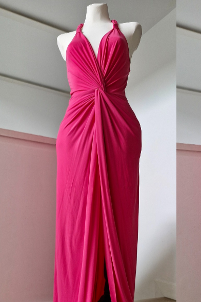 Long fuchsia dress with halter neckline and front slit