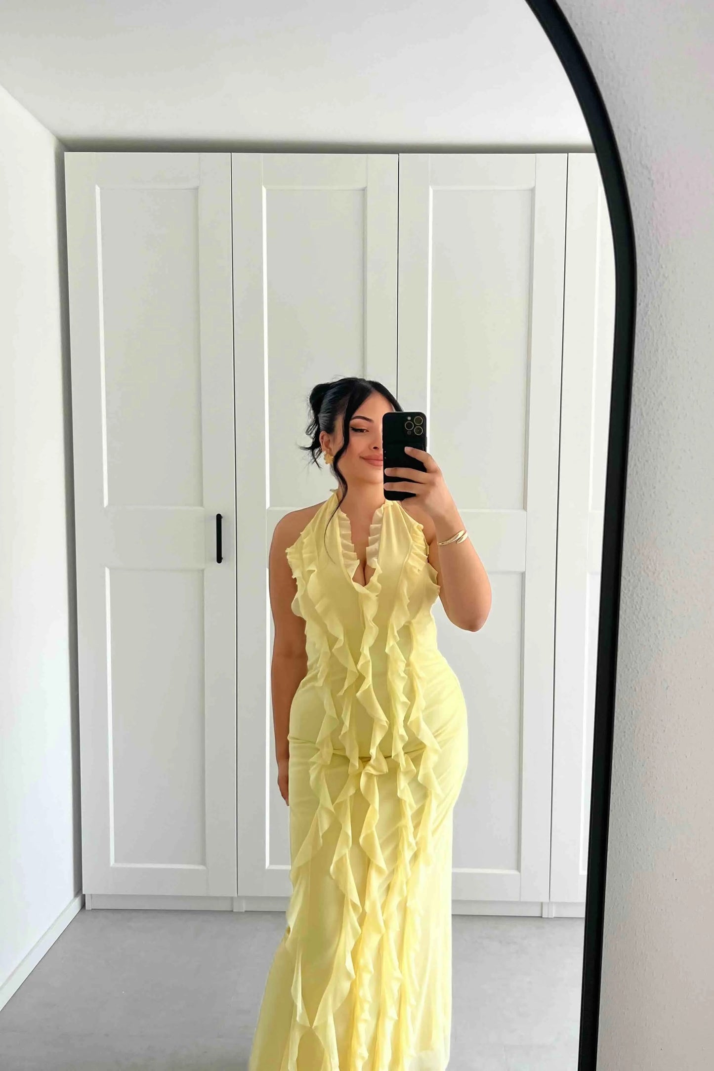 Pastel yellow dress with ruffles and halter neck