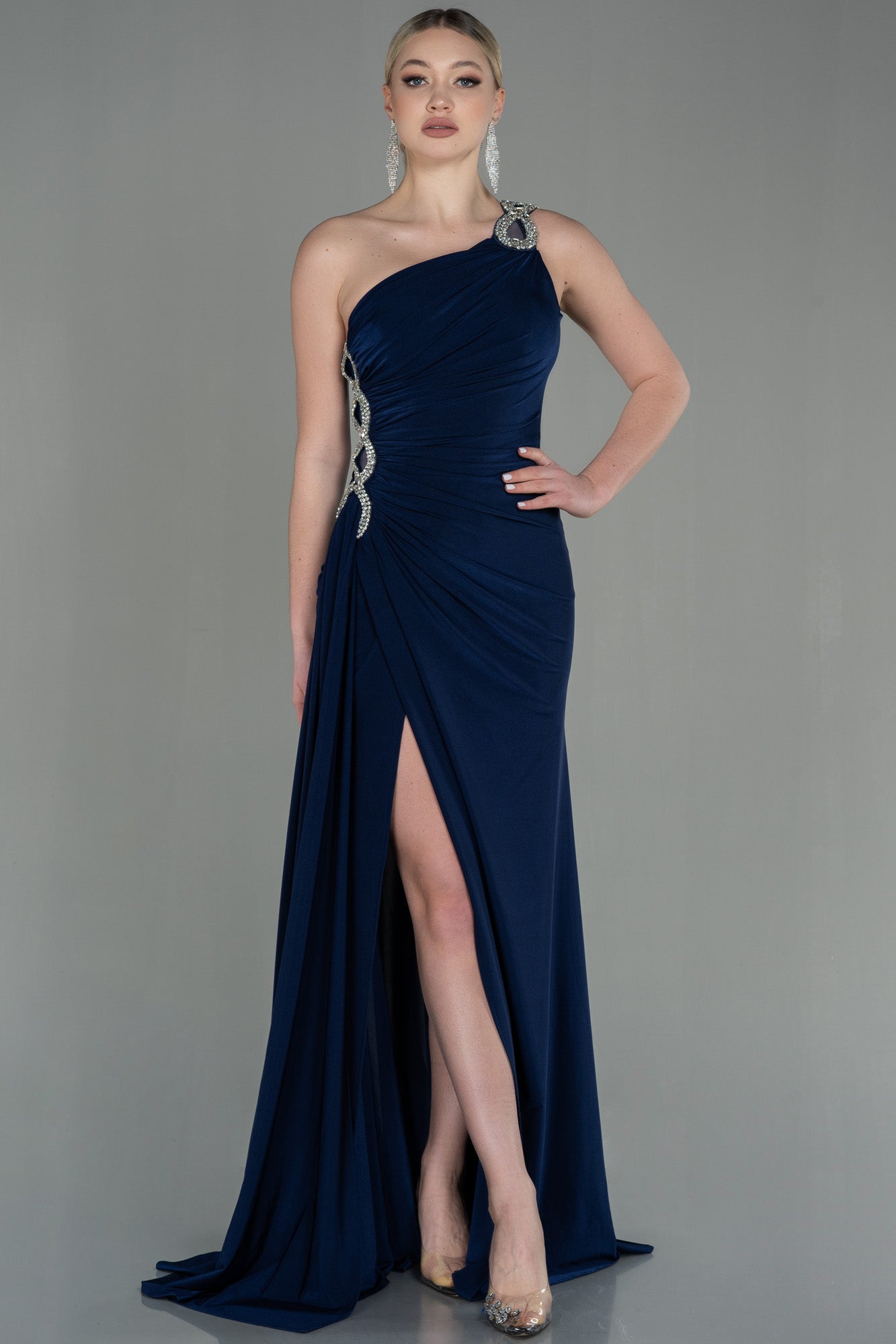 Asymmetrical navy blue guest dress with slit and silver detail