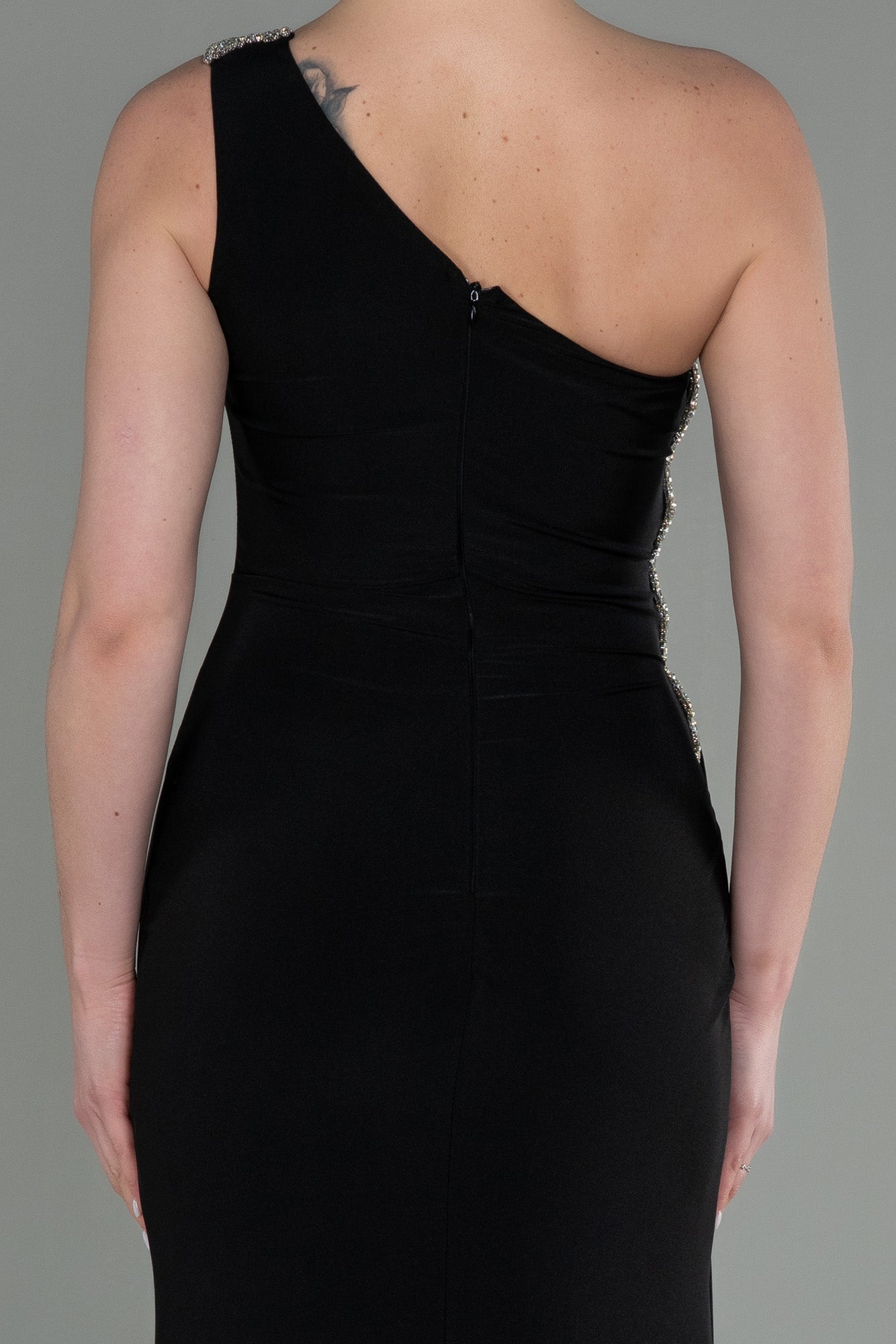 Long asymmetrical black party dress with silver detail