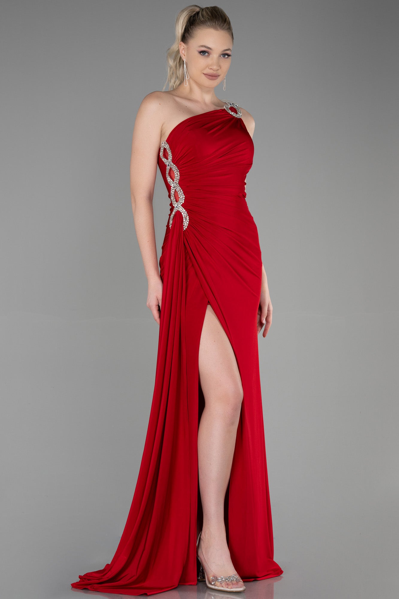 Long asymmetrical red dress with slit and silver detail
