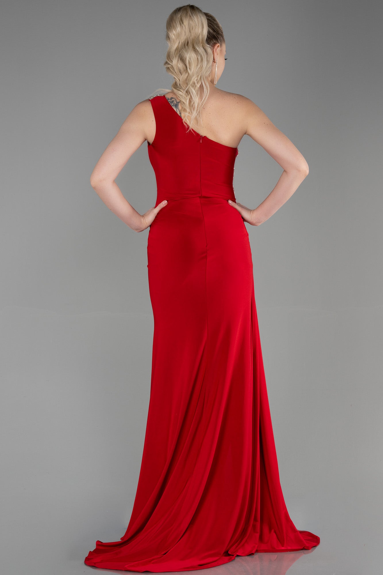 Long asymmetrical red dress with slit and silver detail