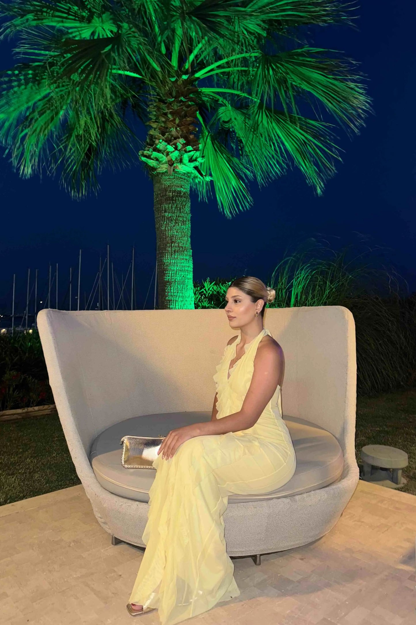Pastel yellow dress with ruffles and halter neck