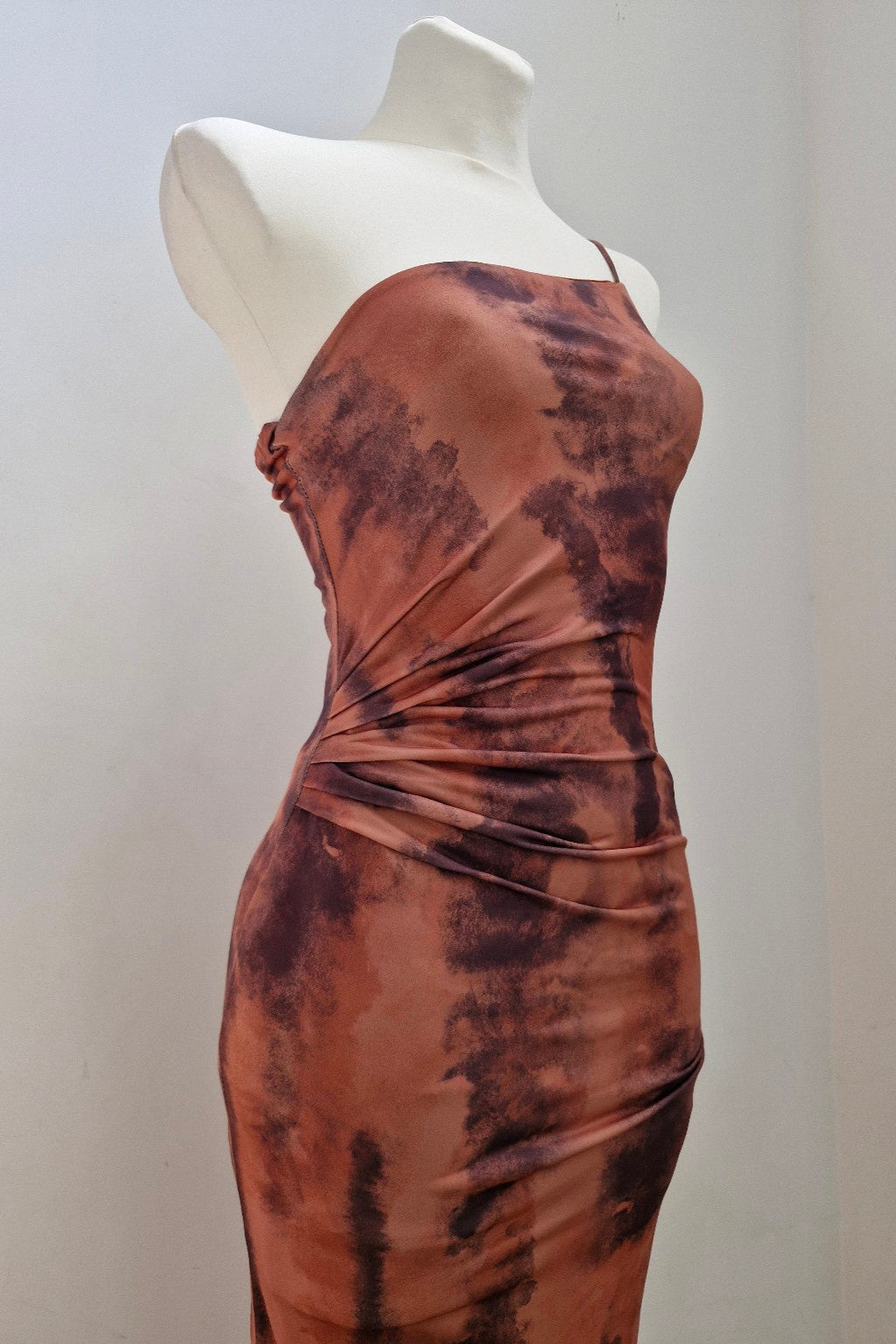 asymmetrical fitted dress in earth tones