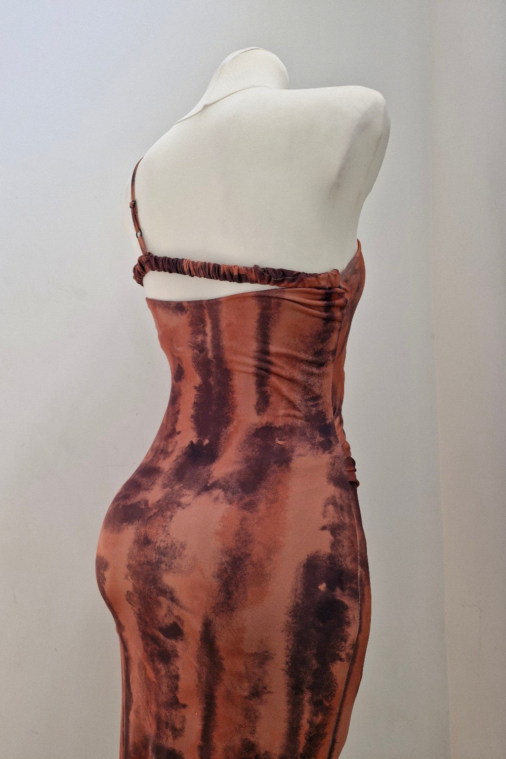 asymmetrical fitted dress in earth tones