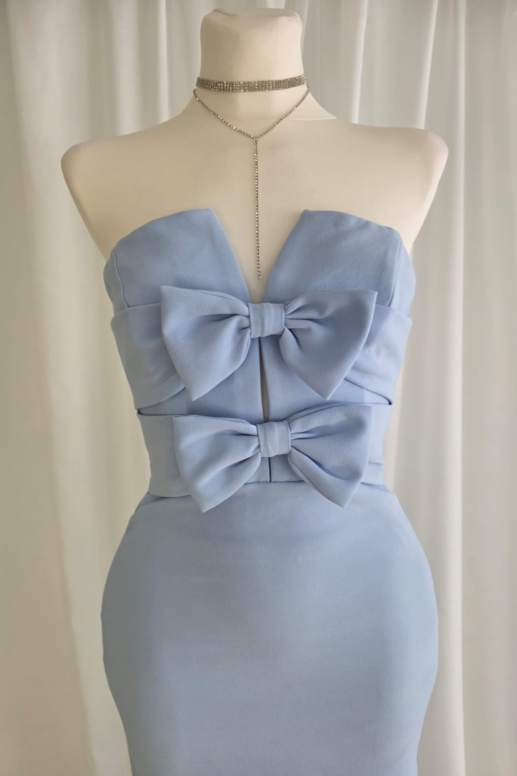 Long pastel blue dress with bow detail and back slit
