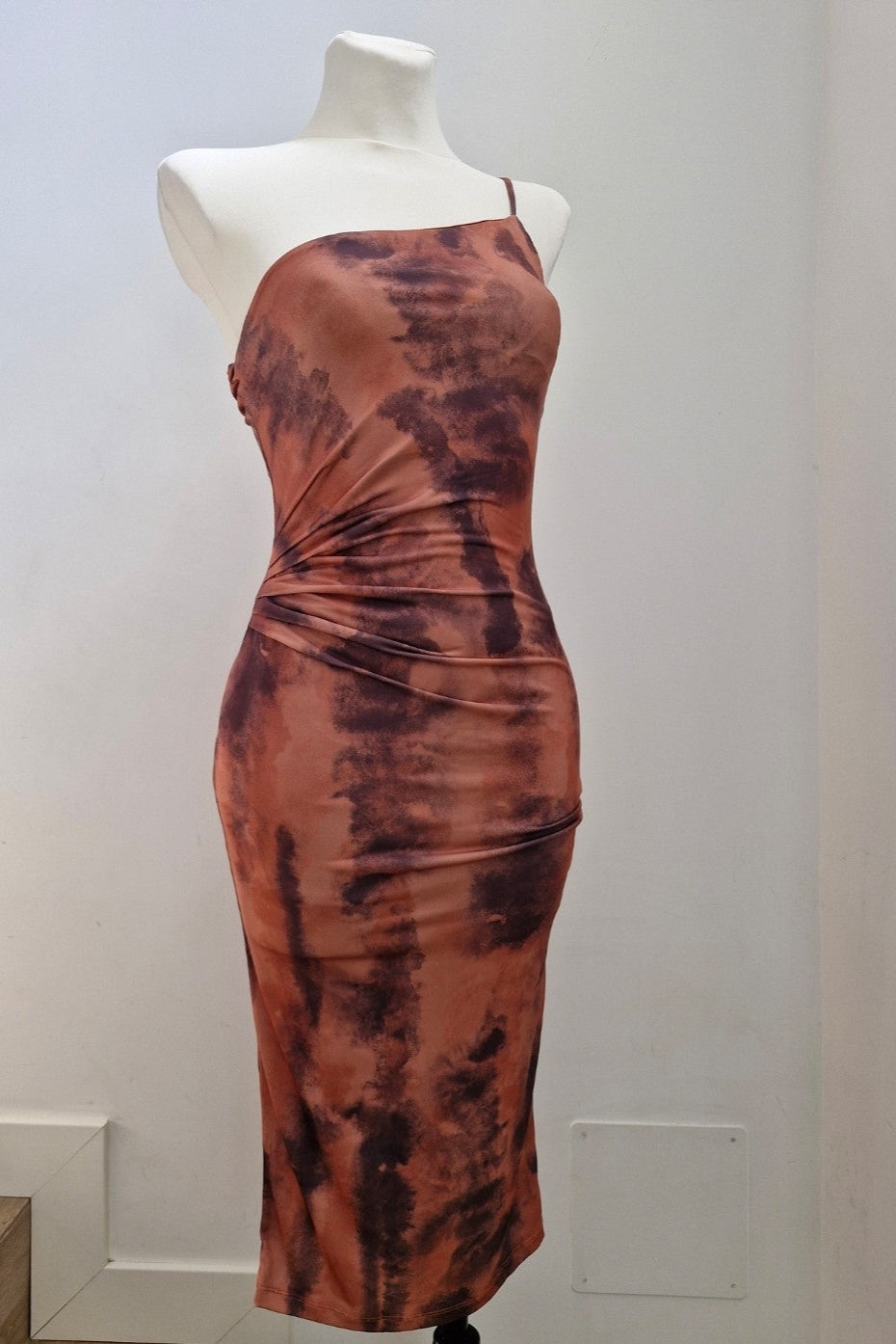 asymmetrical fitted dress in earth tones