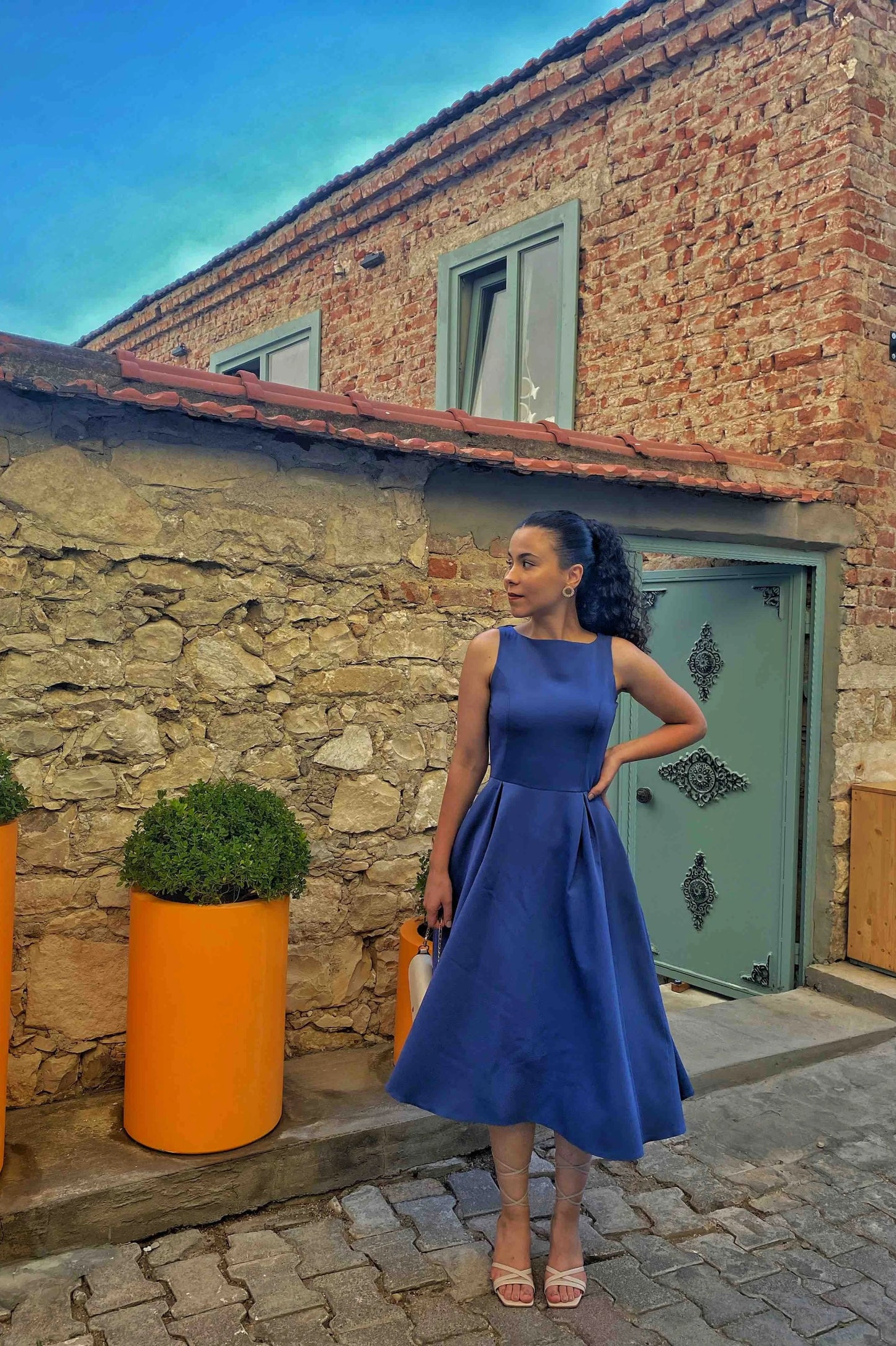 Blue midi dress with a straight neckline and light drape