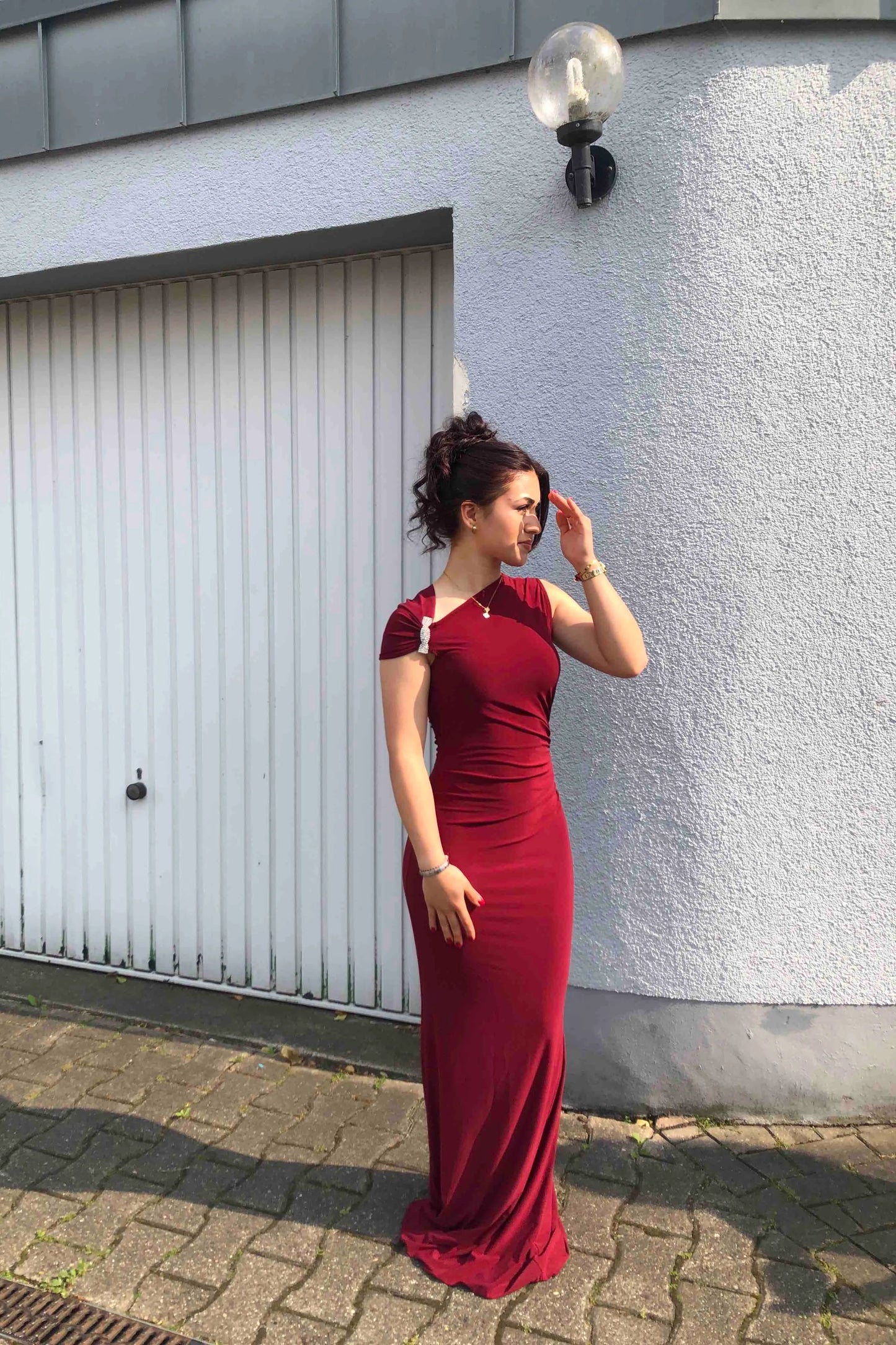 Long asymmetrical burgundy mermaid-cut dress with jewel detail
