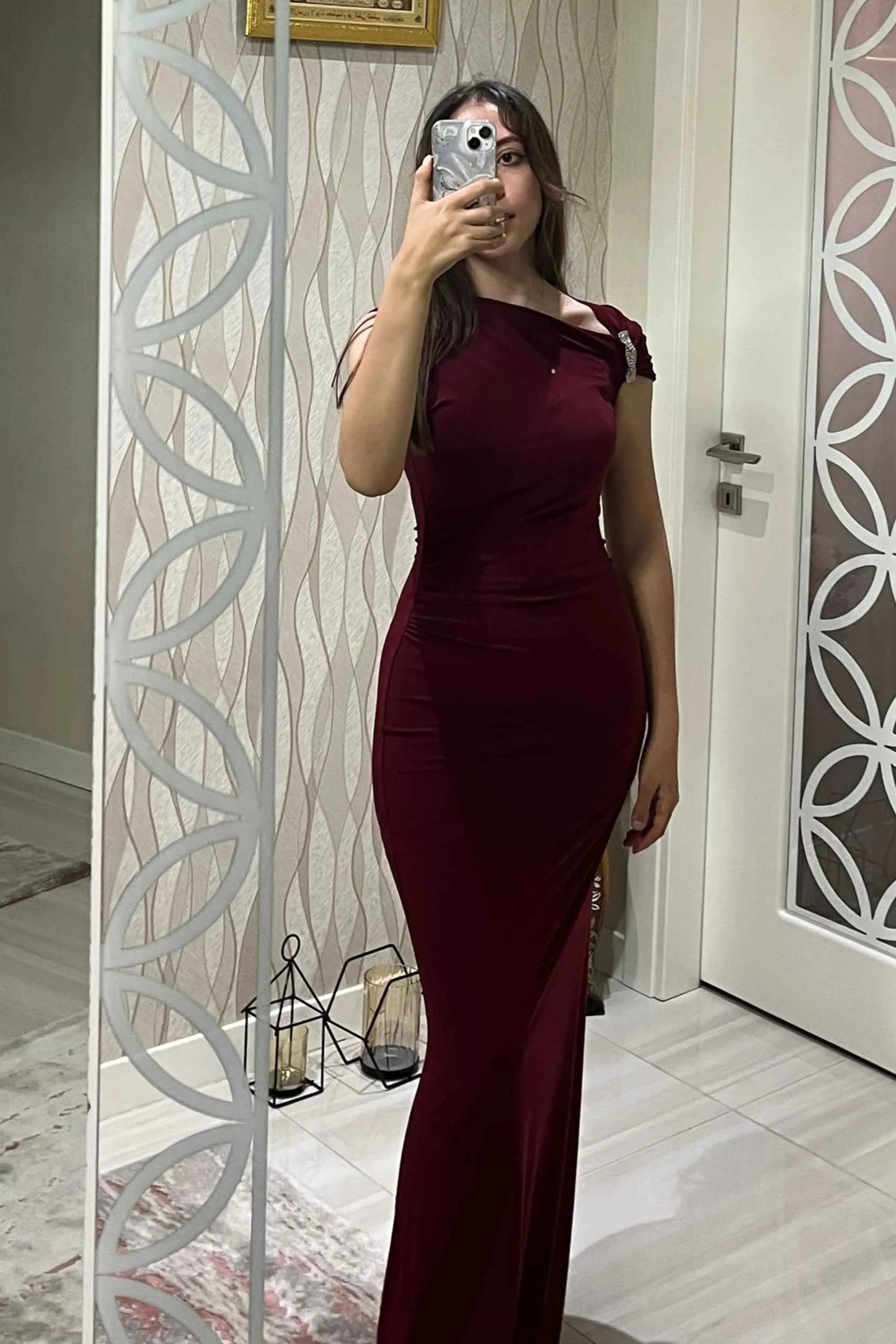 Long asymmetrical burgundy mermaid-cut dress with jewel detail