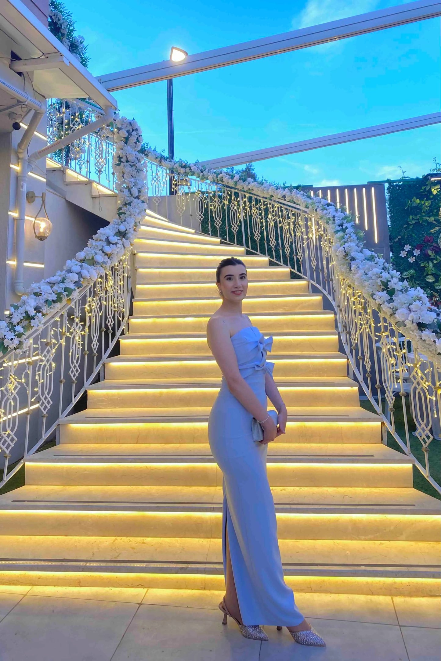 Long pastel blue dress with bow detail and back slit