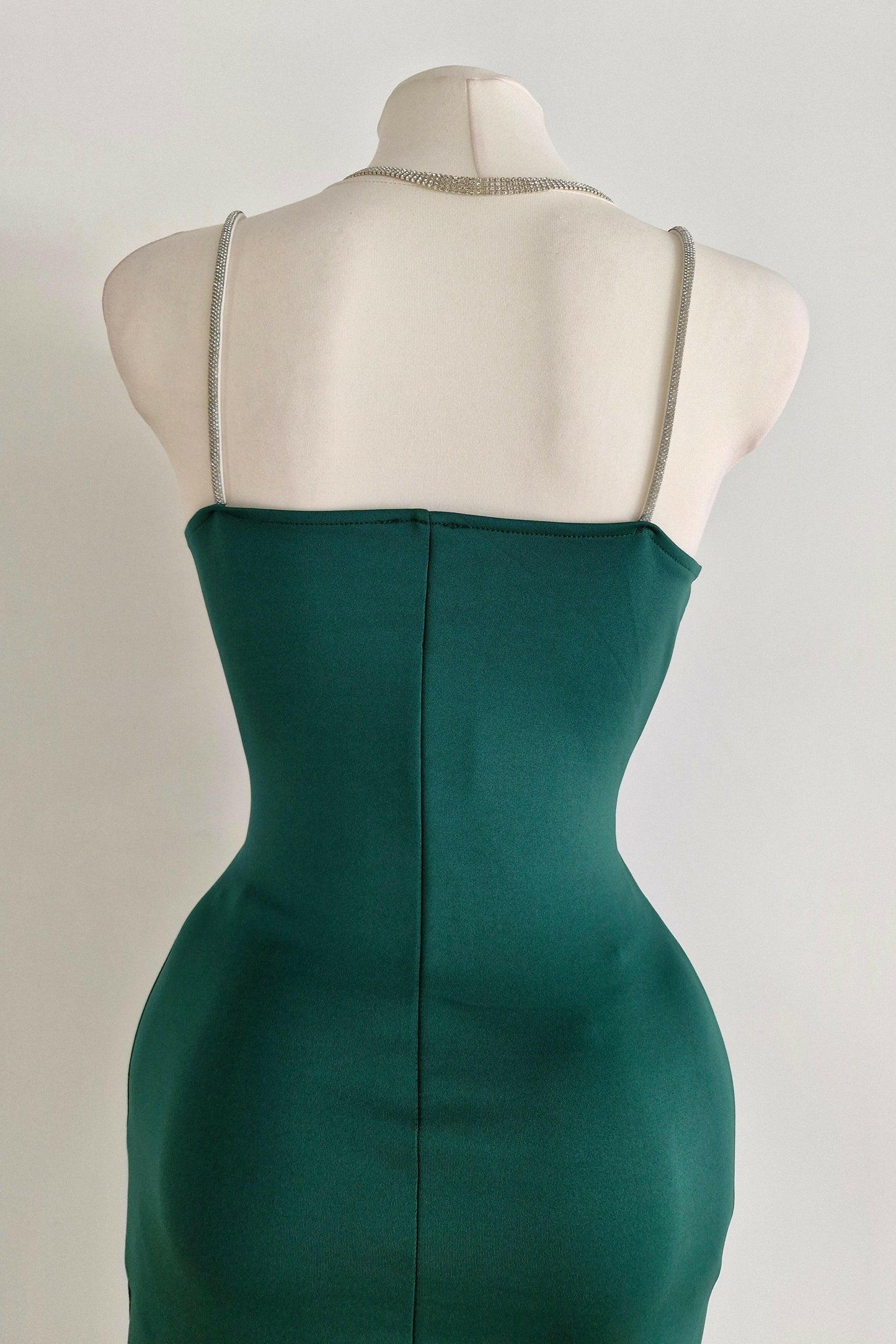 Long green party dress with silver straps
